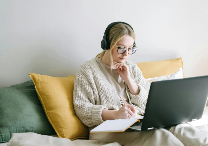 a woman looking on her laptop sending an excuse to work from home
