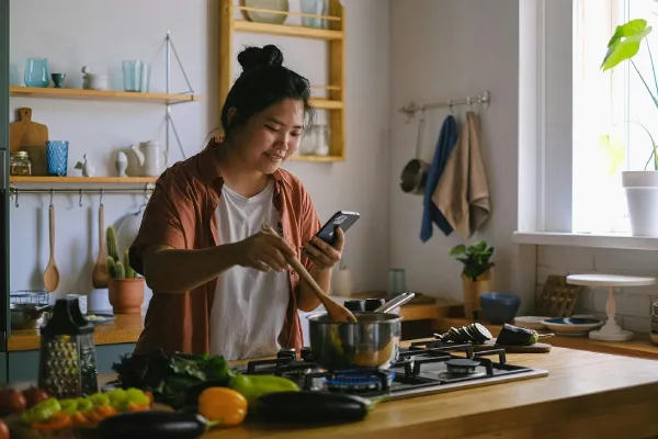 adjusting macros for pcos, asian woman preparing for a meal